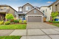 Nice curb appeal of two level house, mocha exterior paint and concrete driveway Royalty Free Stock Photo