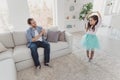 Nice cute sweet lovely attractive cheerful cheery positive stylish elegant pre-teen girl dancing move dad daddy Royalty Free Stock Photo