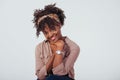 Nice cutie. Beautiful afro american girl with curly hair in the studio with white background Royalty Free Stock Photo