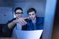 Nice delighted hacker entering a secret password