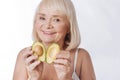 Nice Delighted Woman Putting Two Avocado Halves Together