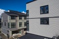 Nice development of new townhouses. Rows of townhomes side by side. External facade of a row of colorful modern urban townhouses. Royalty Free Stock Photo