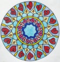 Beautiful painted mandala with herts on white paper