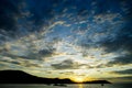 Nice dramatic sky with boat and island background