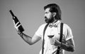 really nice drink. handsome hipster drinking wine glass. sommelier tasting alcohol. bearded man in suspenders drink red Royalty Free Stock Photo