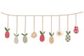 A nice Easter eggs garland decorated with leaves and flowers.