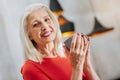 Nice elderly woman holding a cup Royalty Free Stock Photo