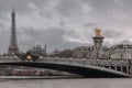 Nice evening scenery of Eiffel Tower and Pont Alexandre III Bridge on Seine River in Paris Royalty Free Stock Photo