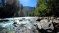 nice fast mountain ridge river with clear water at summertime day - photo of nature Royalty Free Stock Photo