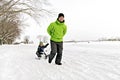 A nice Father drag his boy in sled Royalty Free Stock Photo