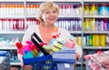 Nice female holding basket in shop Royalty Free Stock Photo