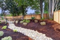 Nice fenced backyard with new planting beds Royalty Free Stock Photo