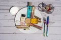 Nice, FRANCE - 21.05.2021 Aesthetic photo. Cosmetic makeup set on the plate on the table as lunch. Powder, lipstick Royalty Free Stock Photo