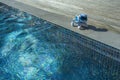 Nice, France 16.10.2020 electronic interactive puppy toy walks by the pool. High technology concept of future electronic animals