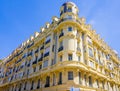 Nice, FRANCE - 07.05.2021: Interesting bright yellow building with sculpture and mosaics on the facade. Old architecture in french Royalty Free Stock Photo