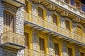 Nice, FRANCE - 07.05.2021: Interesting bright yellow building with sculpture and mosaics on the facade. Old architecture