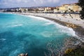 Nice, France, March 2019. Panorama. Azure sea, waves, English promenade and people resting. Rest and relaxation by the sea. On a