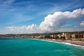 Nice, France, March 2019. Panorama. Azure sea, waves, English promenade and people resting. Rest and relaxation by the sea.