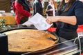 Nice, France, 25th of February 2020: Farinata or Cecina or Torta di ceci thin unleavened pancake Royalty Free Stock Photo