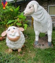 Nice funny animal figures of sheep in asian garden Royalty Free Stock Photo