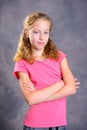 Nice girl with blond hair and pink shirt Royalty Free Stock Photo