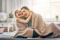 Family playing under blanket