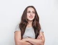 Nice girl with long hair looking to the side with folded arms Royalty Free Stock Photo