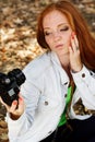 Nice girl photographer taking selfe in autumn park Royalty Free Stock Photo