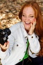 Nice girl photographer taking selfe in autumn park Royalty Free Stock Photo