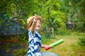 Nice girl playing with water gun Royalty Free Stock Photo