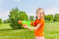 Nice girl playing with water gun Royalty Free Stock Photo