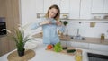 Charming woman cooks phone in hands and composes composition of Royalty Free Stock Photo