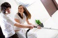 Nice girl with vacuum cleaner and boy Royalty Free Stock Photo