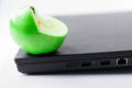 Nice green apple on a computer