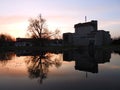 Beautiful homes and trees near lake in evening, Lithuania Royalty Free Stock Photo