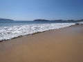 Nice landscape of sandy beach at bay of ACAPULCO city in Mexico with white waves of Pacific Ocean Royalty Free Stock Photo