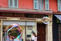 Bubbles float by a building in Nice