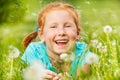 Nice little girl smiles laying on a grass Royalty Free Stock Photo