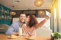 Nice looking couple in cafe Royalty Free Stock Photo