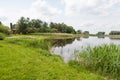 Canal with bank and meadow Royalty Free Stock Photo