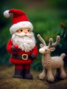 The nice lovely Santa Claus and little deer made of knitting threads. A template for a New Year\'s card.