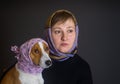 Portrait of beautiful Caucasian woman with lovely basenji dog both wearing headscarfs