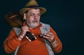 portrait of Caucasian senior musician with mandolin and mouth-organ Royalty Free Stock Photo