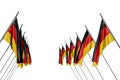 nice many Germany flags hangs on diagonal poles from left and right sides isolated on white - any feast flag 3d illustration