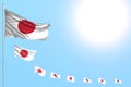 Nice many Japan flags placed diagonal with selective focus and free space for text - any holiday flag 3d illustration