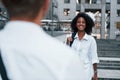 Nice meet. Man with afrian american woman together in the city outdoors Royalty Free Stock Photo