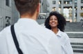 Nice meet. Man with afrian american woman together in the city outdoors Royalty Free Stock Photo