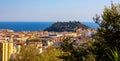 Nice metropolitan view with Colline du Chateau Castle Hill, Mont Boron Mountain, Vielle Ville, Riquier and Port district in France Royalty Free Stock Photo