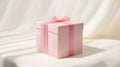 A nice and minimalistic paper square gift box with a red stripe on the side Royalty Free Stock Photo