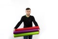 Nice and modern smiling young worker with beard holding vinyl rolls